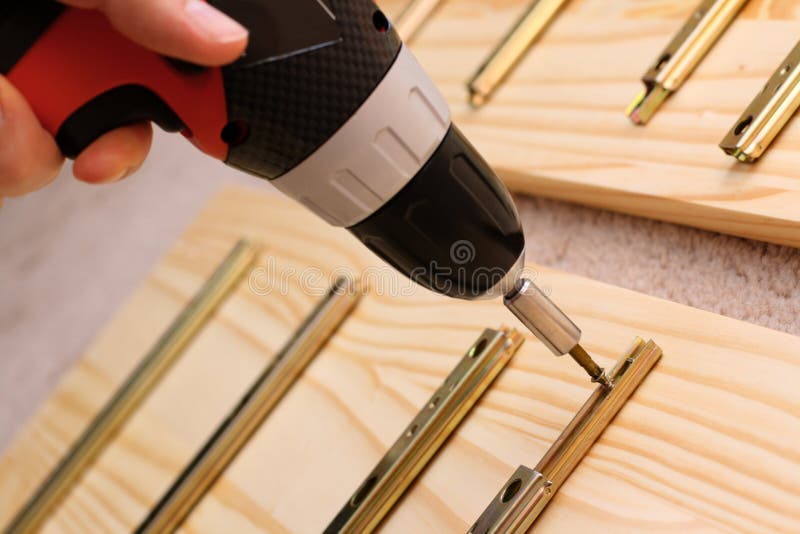 Mounting furniture with screwdriver