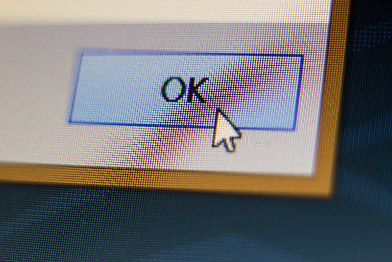 Mouse cursor clicking OK button royalty free stock image