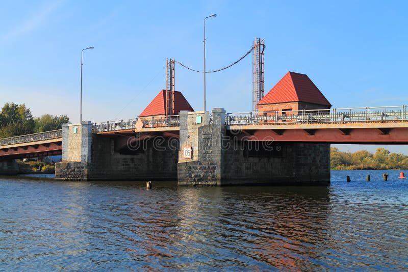 Movable bridge Eagle through Deym's river. POLESSK, KALININGRAD REGION, RUSSIA - OCTOBER 15, 2015: Movable bridge Eagle through Deym's river in the city of stock photos Movable bridge Eagle through Deym's river. POLESSK, KALININGRAD REGION, RUSSIA - OCTOBER 15, 2015: Movable bridge Eagle through Deym's river in the city of stock photos