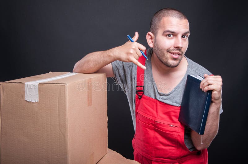 Mover guy holding agenda making calling gesture royalty free stock photography