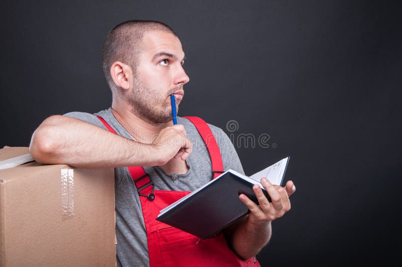 Mover guy holding agenda making thinking gesture royalty free stock photos