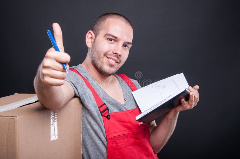 Mover guy holding agenda making thumb up gesture royalty free stock photos