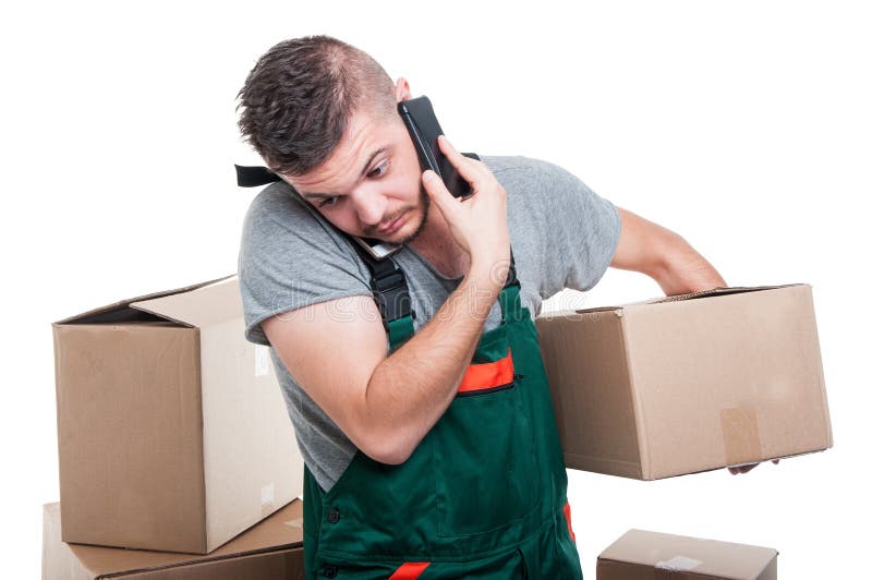 Mover guy holding cardboard box talking at phone royalty free stock photos