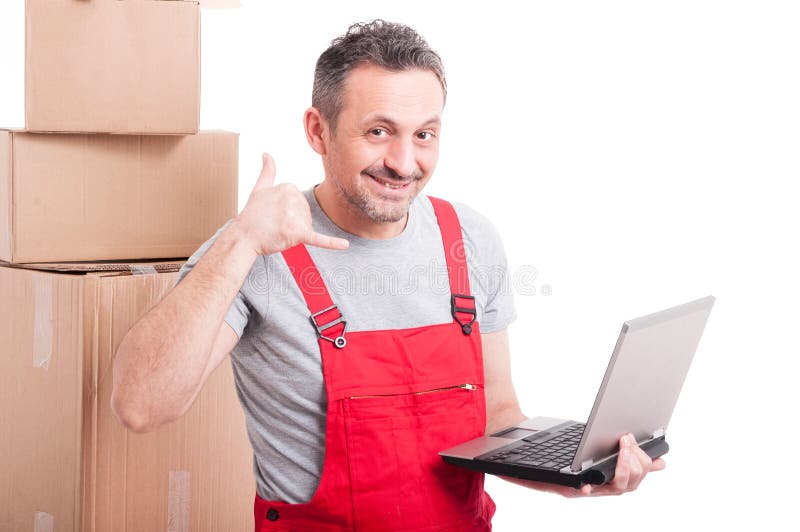 Mover guy holding laptop making calling gesture royalty free stock image