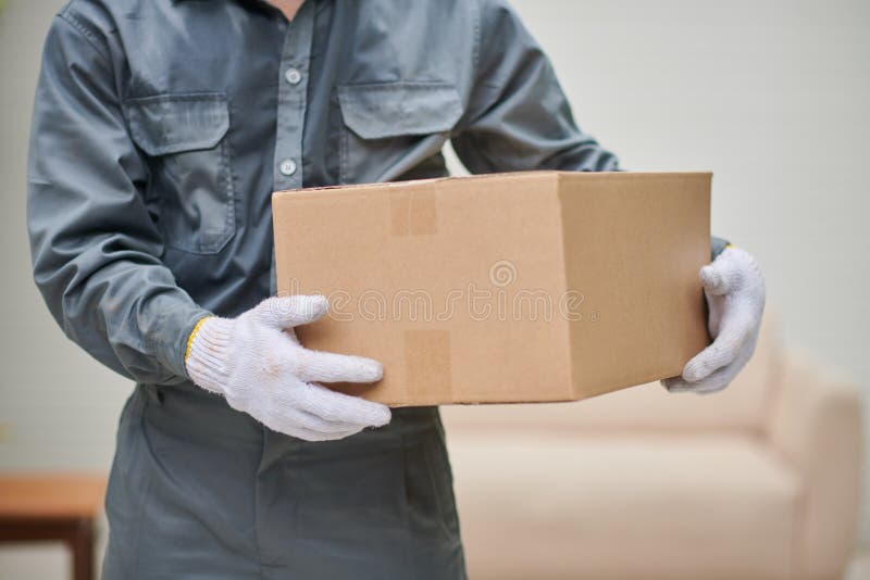 Mover Holding Cardboard Box stock photography