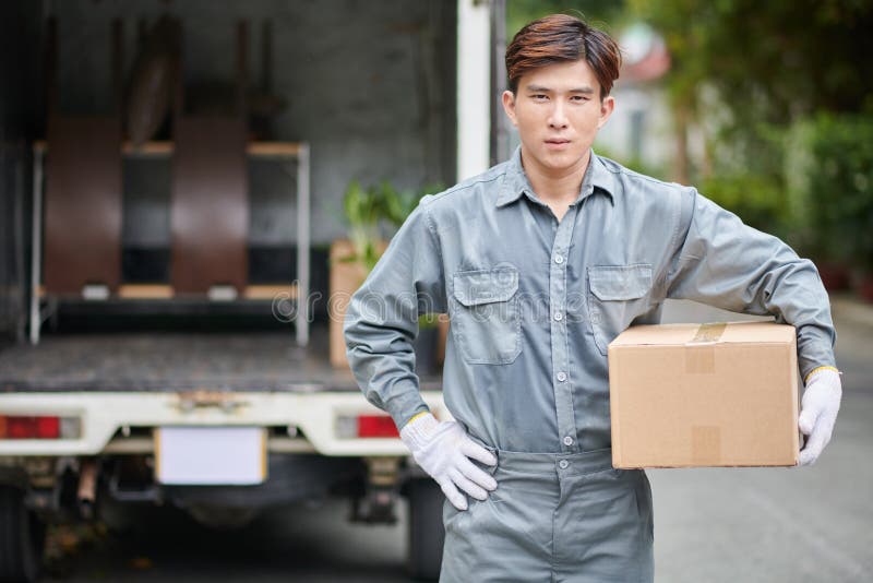 Mover Holding Cardboard Box royalty free stock photography