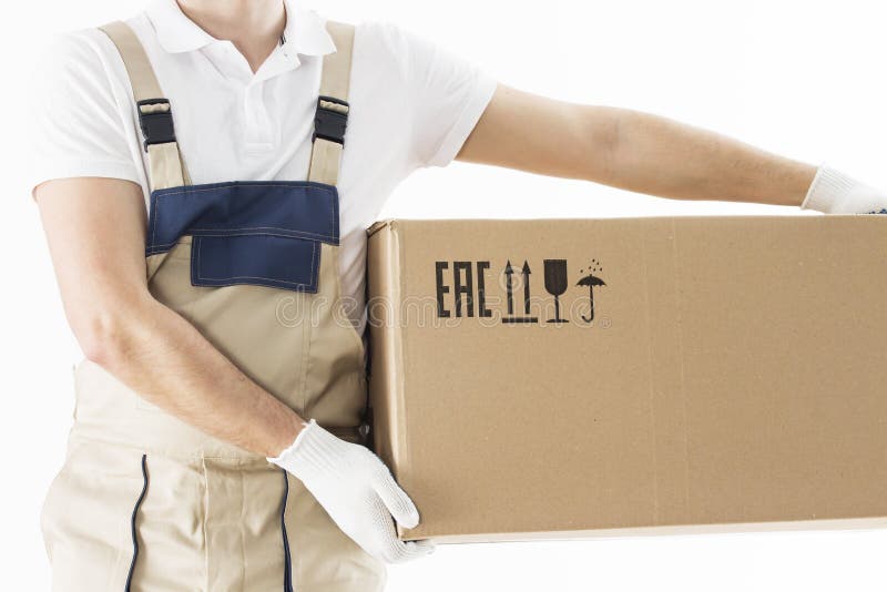 Mover holding in hands cardboard box isolated on white background. Relocation services concept. Loader in uniform with box royalty free stock images