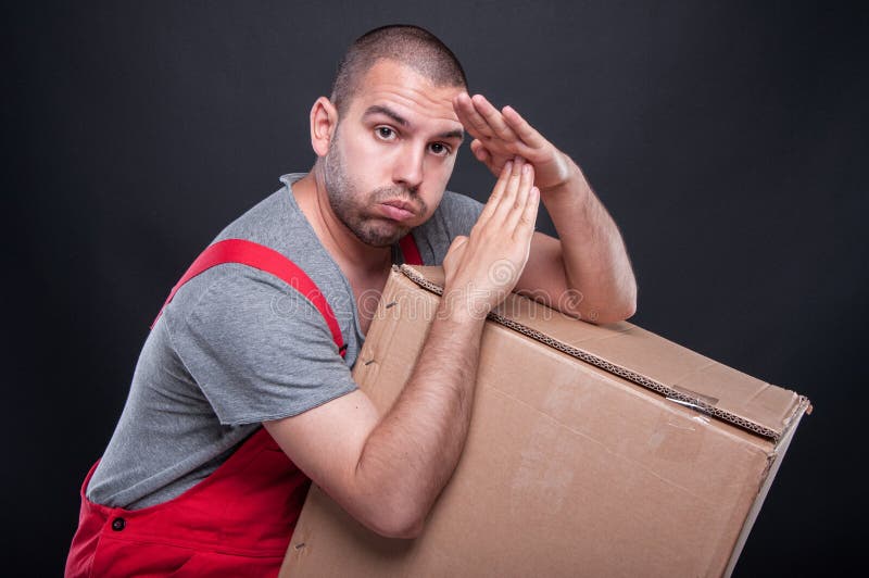 Mover man holding box making time out gesture stock photography