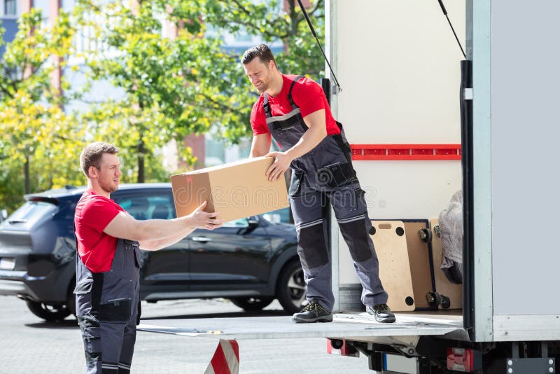 Movers Unloading Furniture from Truck Stock Image Image of mover
