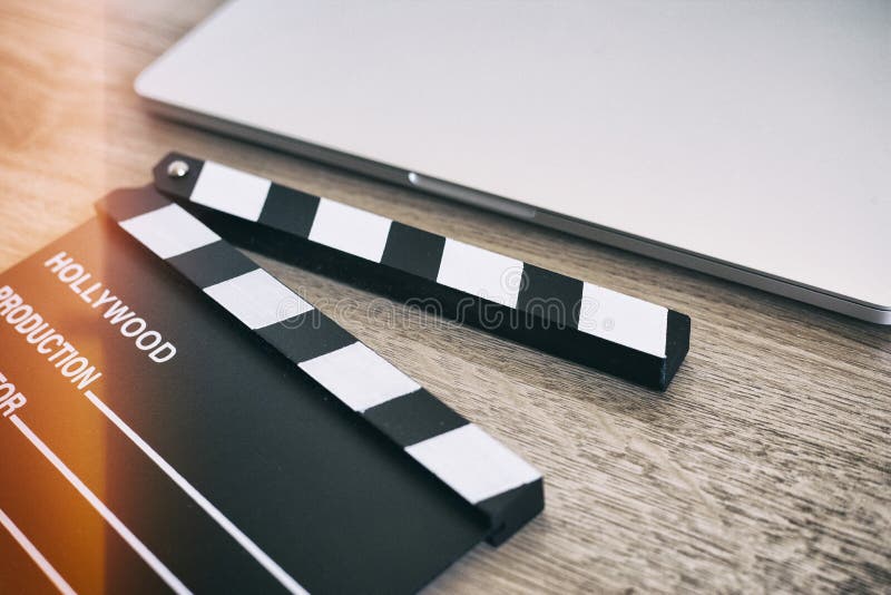 Movie clapper and laptop on the wood royalty free stock photos Movie clapper and laptop on the wood royalty free stock photos