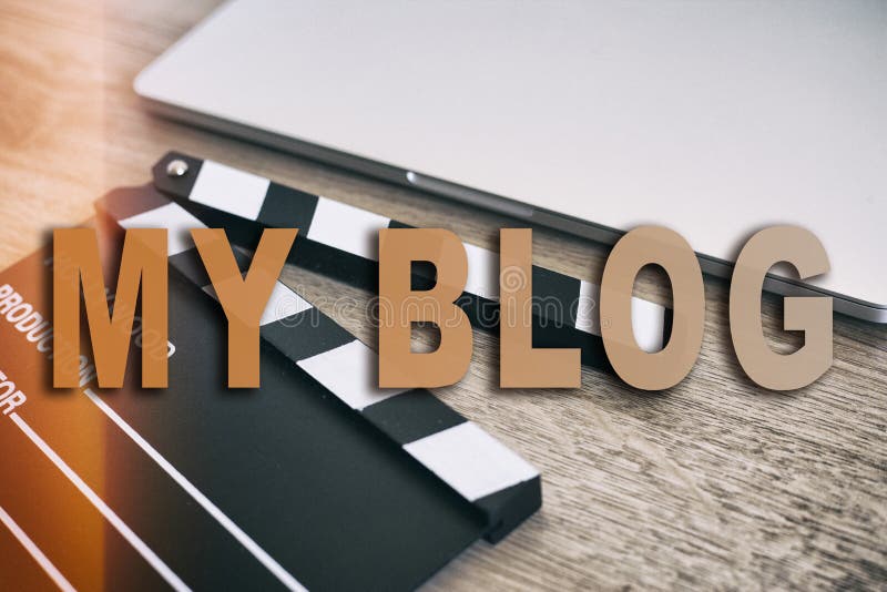 Movie clapper and laptop on the wood table. Words MY BLOG royalty free stock photo Movie clapper and laptop on the wood table. Words MY BLOG royalty free stock photo