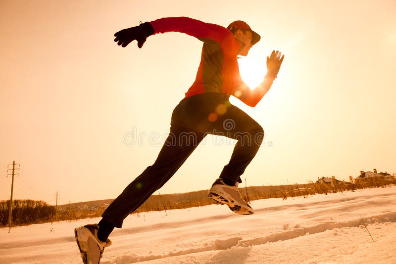 Athletic man running in winter morning. Athletic man running in winter morning