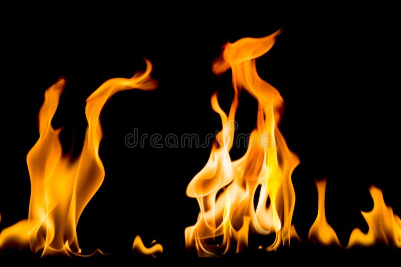 Movimiento del helada de la llama Rojo-amarilla del fuego que quema en la noche oscura fotografía de archivo Movimiento del helada de la llama Rojo-amarilla del fuego que quema en la noche oscura fotografía de archivo
