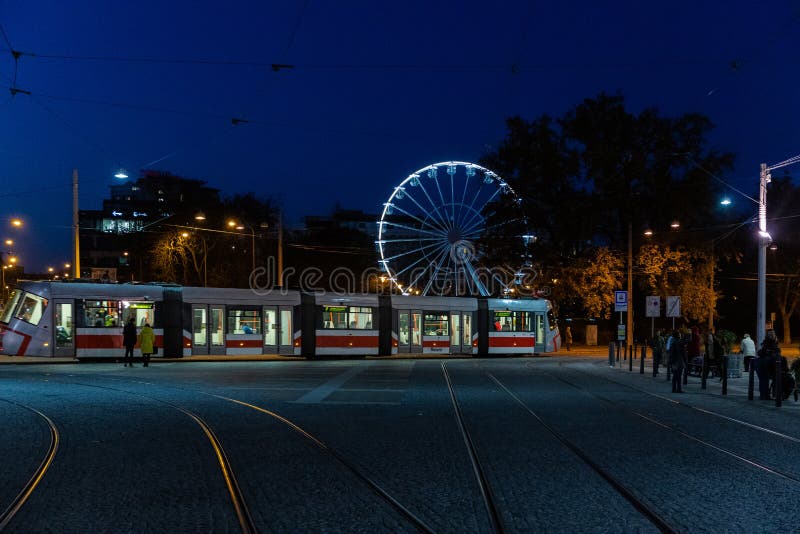 Moving big Ferris wheel in Brno, Czech Republic in Moravske square from the side during setup for Christmas event captured at