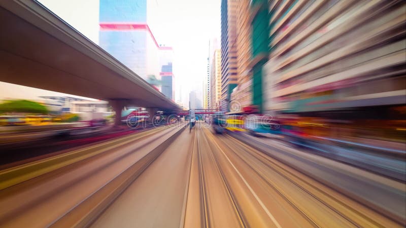 Moving through bright modern city street with skyscrapers. Time lapse. Hong Kong