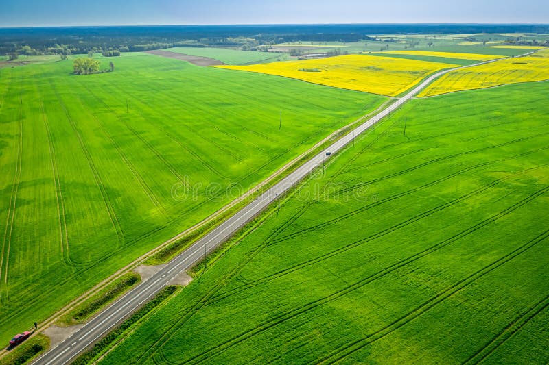 Top view scenic winding country road through green farmland. Clip. Aerial  rural road countryside Stock Photo - Alamy