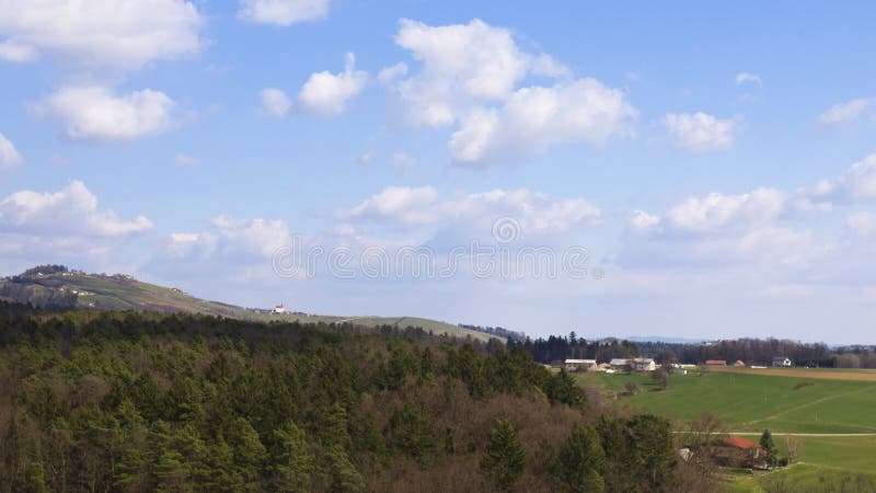 Moving cloudscape above rural landscape, aerial hyper lapse