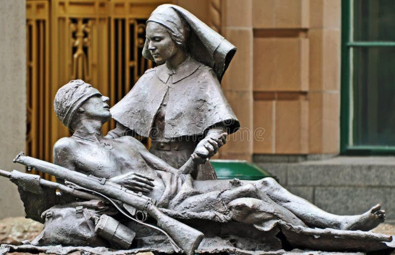 A moving and expertly crafted iron statue of an Australian digger soldier hurting with wounds, with a Red Cross nurse at his side, showing him warmth and compassion in his suffering. One of the incredible art pieces in remembrance of the brave men and women who have fought in past battles,lest we forget. The statues are in Anzac Square in the middle of Brisbane city, Queensland, Australia. A moving and expertly crafted iron statue of an Australian digger soldier hurting with wounds, with a Red Cross nurse at his side, showing him warmth and compassion in his suffering. One of the incredible art pieces in remembrance of the brave men and women who have fought in past battles,lest we forget. The statues are in Anzac Square in the middle of Brisbane city, Queensland, Australia.