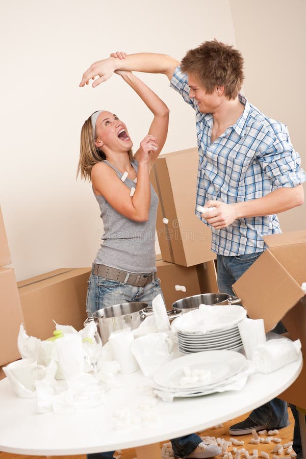 Moving house: Young couple having fun