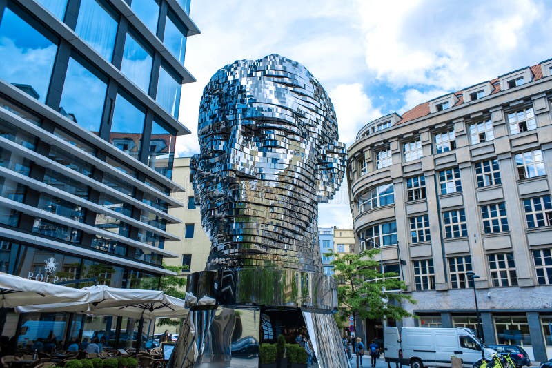 Moving monument head Franz Kafka in the center of Prague. art object chromed shiny sculpture of 64 plates