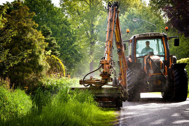 Mowing grass shoulder stock photos