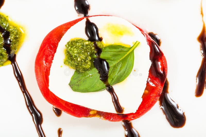 Mozzarella cheese and tomato slices with basil