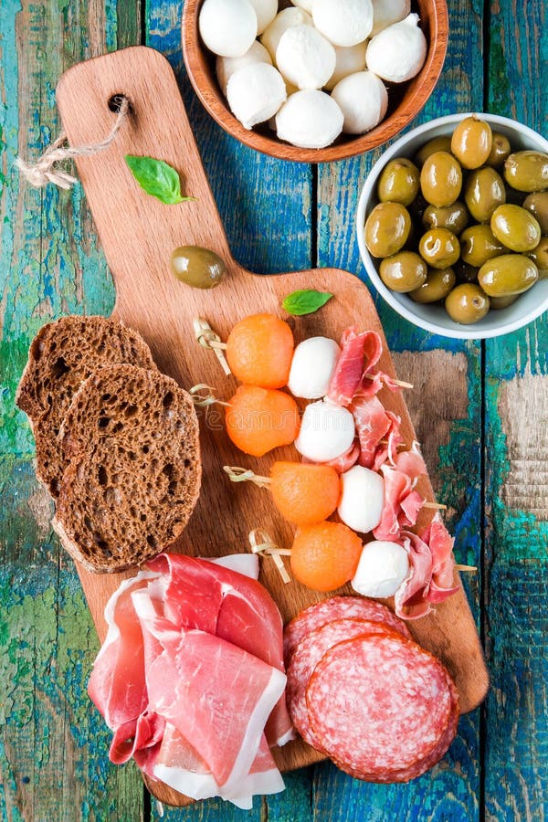 Mozzarella, Prosciutto, Melon Canapes with Salami, Olives and Bread