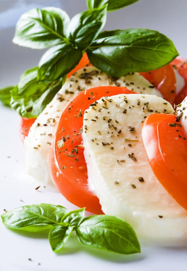 Mozzarella with tomatoes stock image. Image of italian 25562149