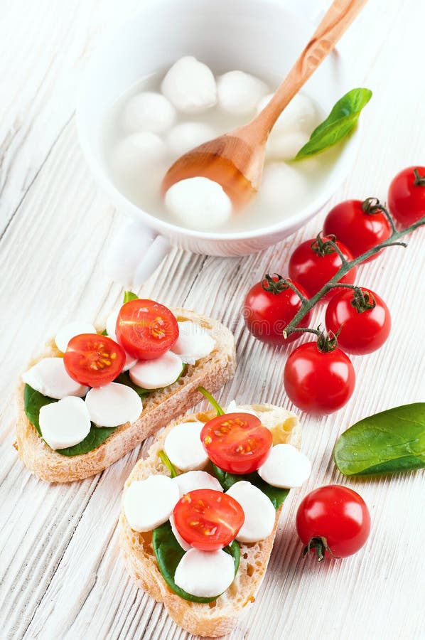 Mozzarella, Tomatoes and Bread. Stock Photo Image of dish, italy