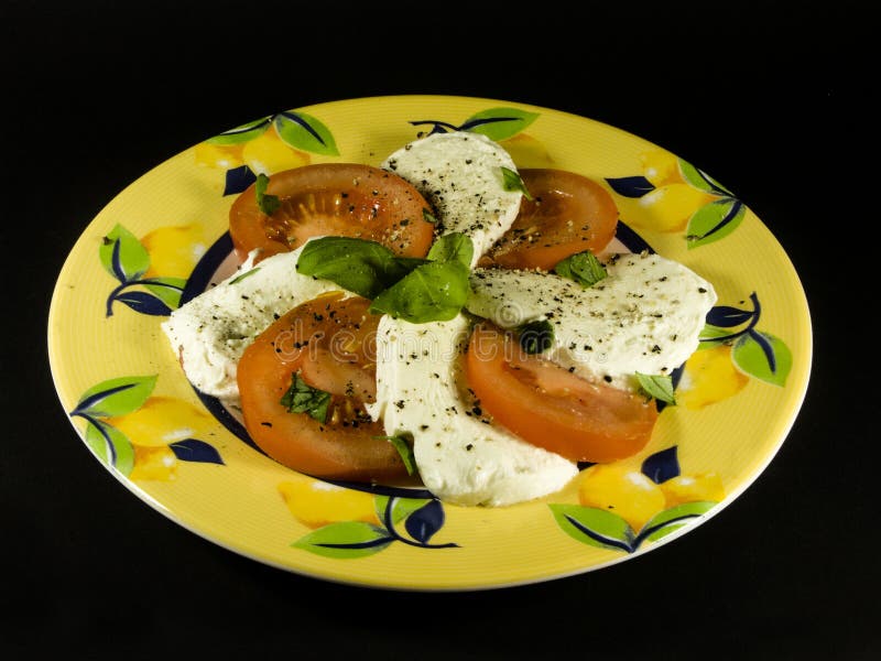 Mozzarella With Tomatoes On A Plate Stock Photo Image of white