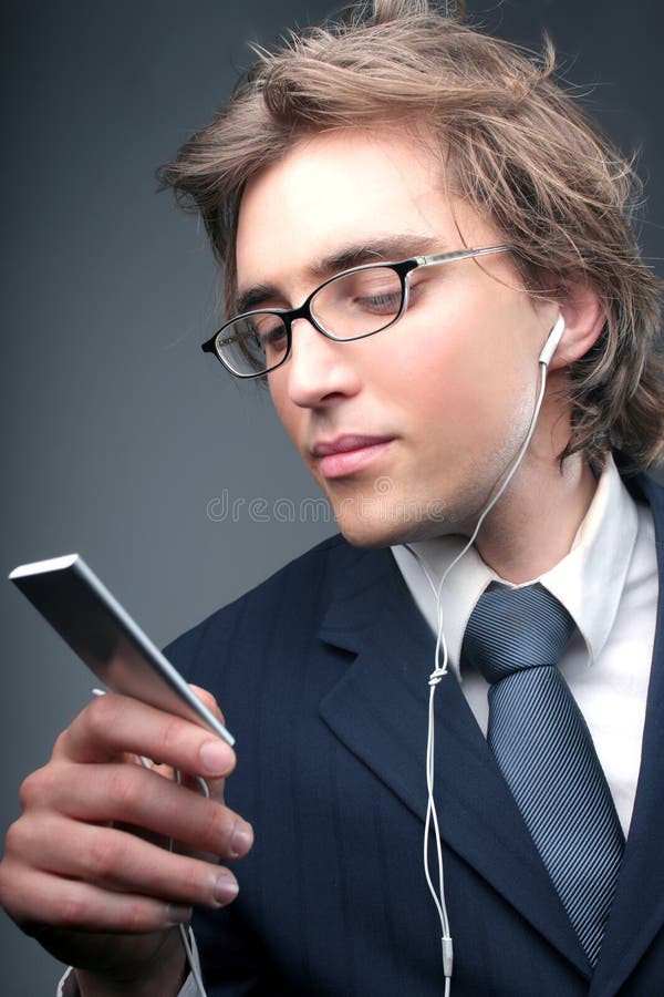 A business man with mp3 player