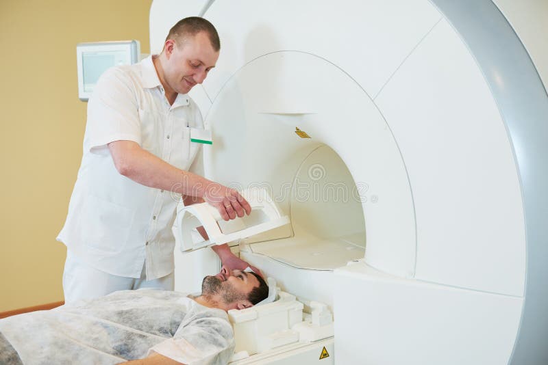 Computed tomography or MRI scan test. Male radiologist men preparing patient for CT scanning. Computed tomography or MRI scan test. Male radiologist men preparing patient for CT scanning