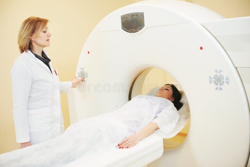 Computed tomography or MRI scan test. female radiologist preparing young women patient for CT scanning. Computed tomography or MRI scan test. female radiologist preparing young women patient for CT scanning