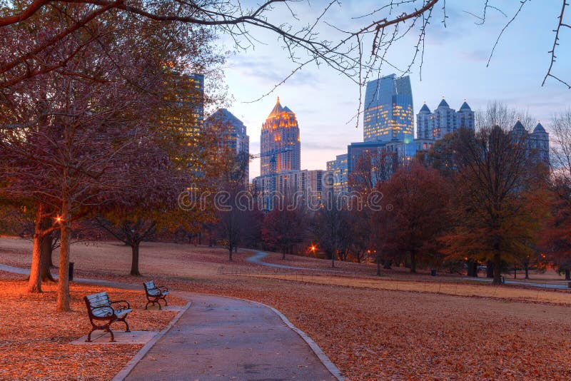 View of the Oak Hill in the Piedmont Park and Midtown Atlanta behind it in autumn twilight, USA. View of the Oak Hill in the Piedmont Park and Midtown Atlanta behind it in autumn twilight, USA