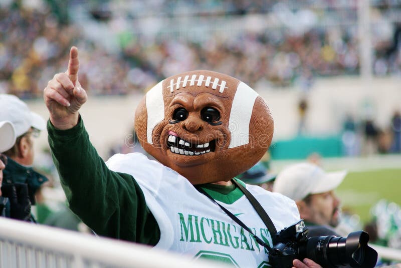 MSU contre le Michigan, passioné du football photographie stock libre de droits MSU contre le Michigan, passioné du football photographie stock libre de droits
