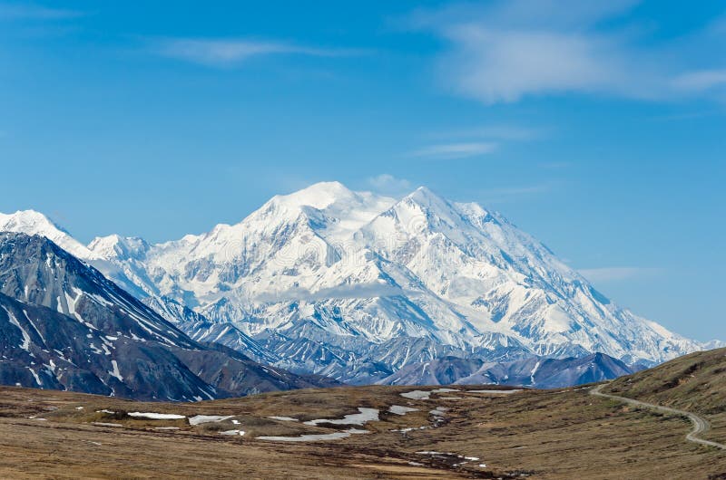 DENALI NATIONAL PARK, ALASKA, USA - JUNE 9 2013: Mt McKinley on a clear day on June 9 2013 in Alaska. Mt McKinley is the highest mountain in North America and on August 28 2015 was renamed to Denali. DENALI NATIONAL PARK, ALASKA, USA - JUNE 9 2013: Mt McKinley on a clear day on June 9 2013 in Alaska. Mt McKinley is the highest mountain in North America and on August 28 2015 was renamed to Denali.