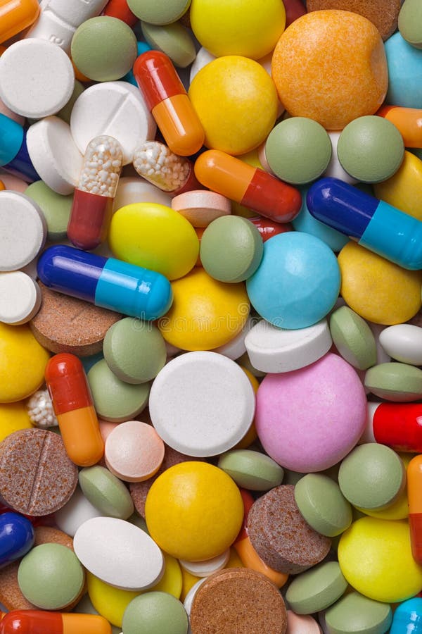 Mucchio delle compresse variopinte dei farmaci - fondo medico fotografia stock Mucchio delle compresse variopinte dei farmaci - fondo medico fotografia stock