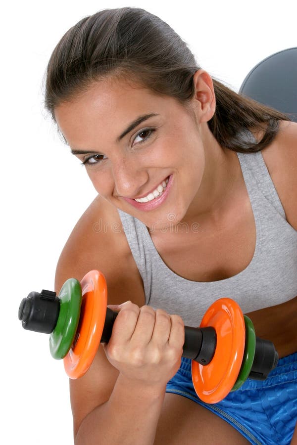 Beautiful dark haired tan teen girl in workout clothes over white with hand weights. Shot with the Canon 20D. Beautiful dark haired tan teen girl in workout clothes over white with hand weights. Shot with the Canon 20D.