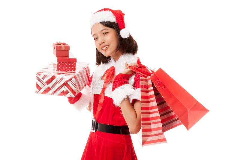 Muchacha asiática de Santa Claus de la Navidad con los panieres y el regalo imagenes de archivo Muchacha asiática de Santa Claus de la Navidad con los panieres y el regalo imagenes de archivo