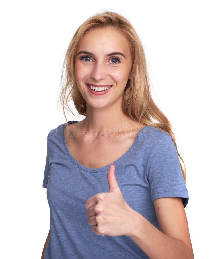 Muchacha bonita que sonríe y que muestra los pulgares para arriba fotos de archivo Muchacha bonita que sonríe y que muestra los pulgares para arriba fotos de archivo