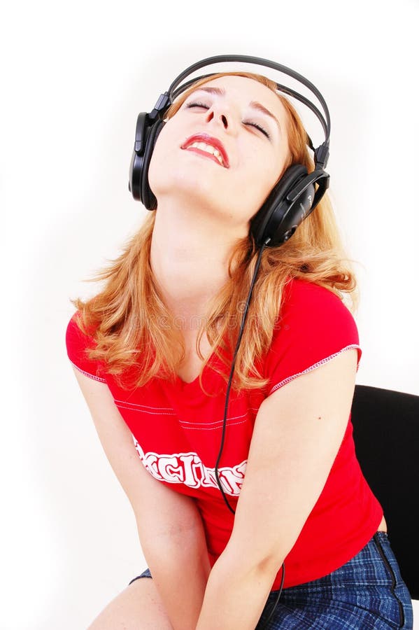 Muchacha con el receptor de cabeza foto de archivo