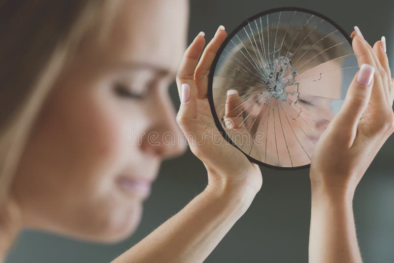 Teenage girl with beauty complexes not looking at her mirror reflection. Teenage girl with beauty complexes not looking at her mirror reflection