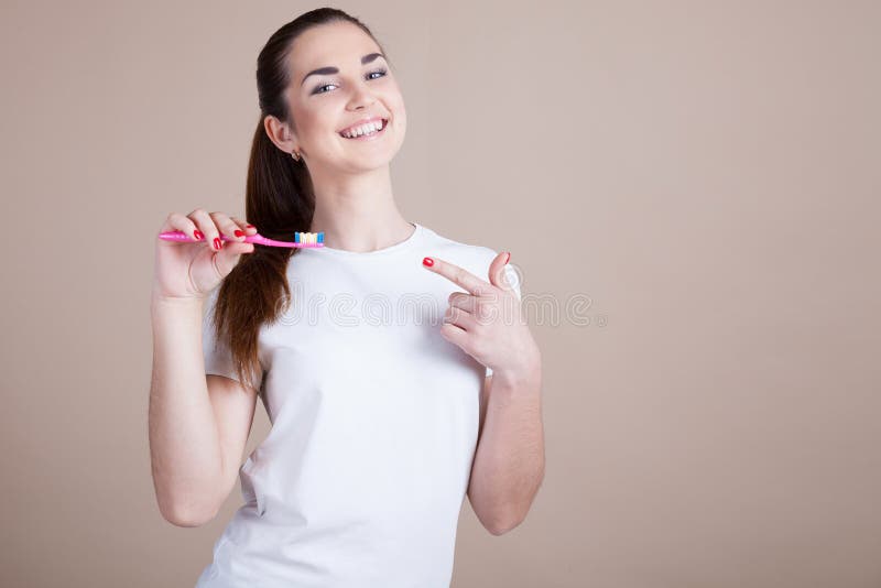 Muchacha con un cepillo de dientes imagenes de archivo Muchacha con un cepillo de dientes imagenes de archivo