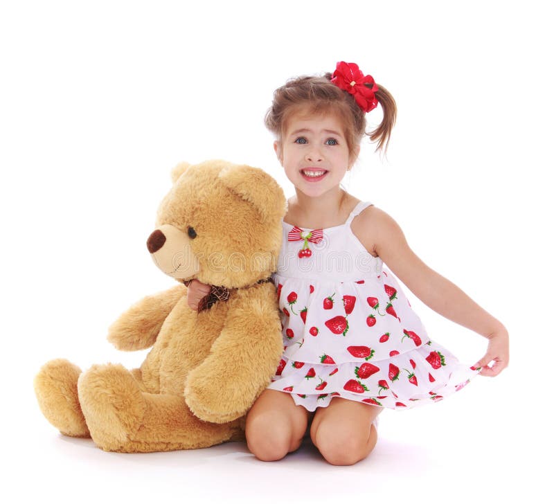 Muchacha con un oso de peluche fotos de archivo libres de regalías Muchacha con un oso de peluche fotos de archivo libres de regalías