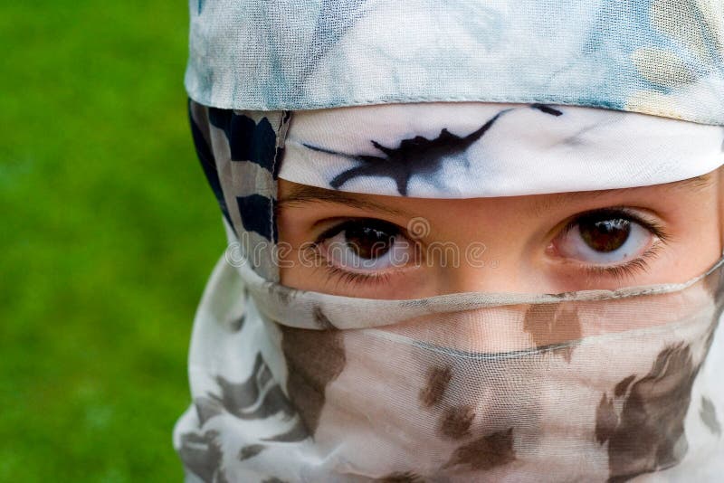 Young girl dressed in a veil like a moslem girl, she is not a moslem but this image resembles moslem traditional and fundamentalistic dress code. Her face expression is that of determination and self-confidence, which may be annoying to some . Young girl dressed in a veil like a moslem girl, she is not a moslem but this image resembles moslem traditional and fundamentalistic dress code. Her face expression is that of determination and self-confidence, which may be annoying to some ...