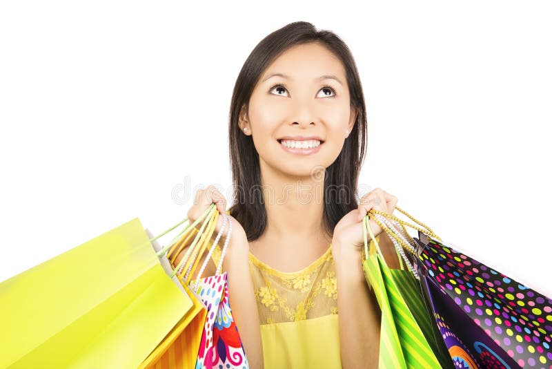Muchacha de compras que mira para arriba imagen de archivo Muchacha de compras que mira para arriba imagen de archivo