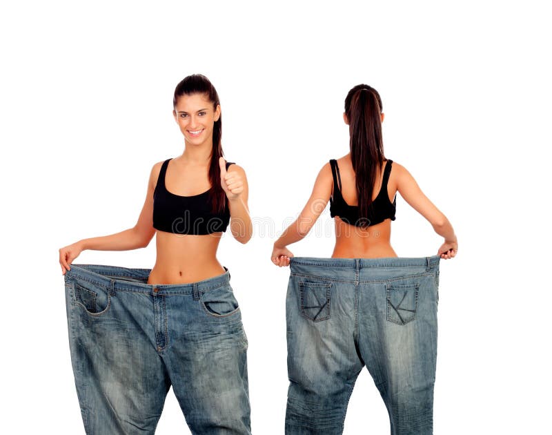 Muchacha delgada con los pantalones grandes de los vaqueros fotos de archivo libres de regalías Muchacha delgada con los pantalones grandes de los vaqueros fotos de archivo libres de regalías