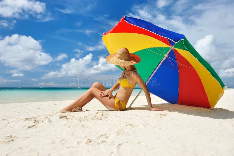 Girl on a tropical beach with hat. Girl on a tropical beach with hat