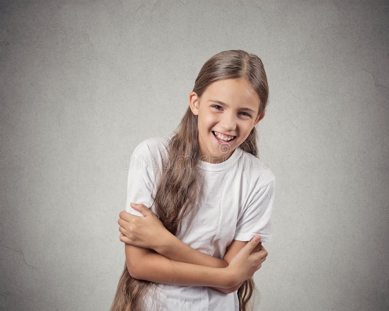 Closeup portrait teenager girl laughing isolated on white background. Positive human emotion facial expression feelings, body language reaction attitude perception. Closeup portrait teenager girl laughing isolated on white background. Positive human emotion facial expression feelings, body language reaction attitude perception