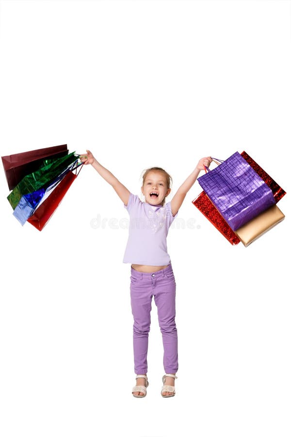 Muchacha feliz con los panieres que se colocan en el estudio foto de archivo Muchacha feliz con los panieres que se colocan en el estudio foto de archivo
